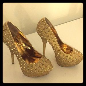 Gold spiked heels from sheikh
